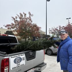 Bruce’s Christmas Trees Fresno - My dad with the new tree all secured and ready to put up.