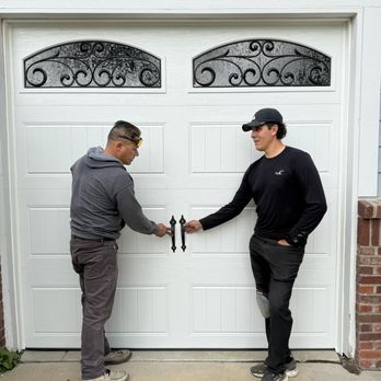 Affordable Door Co - Leo and co-worker showing me the decorative handles. I decided not to have them drill and install these at this time. - Garage Door Services Near Me - Castle Pines, Colorado Affordable Door Co - Leo and co-worker showing me the decorative handles. I decided not to have them drill and install these at this time. - Garage Door Services Near Me - Castle Pines, Colorado