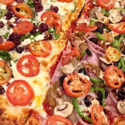 Kozeta's Restaurant - Mixing toppings on "The Best Pizza in Maine". All super fresh ingredients. No short cuts. Old World style and attitude!