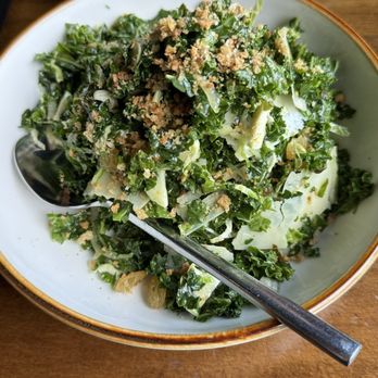 Pelican & Pig - Kale, shaved brussels, golden raisin, parmesan, crispy capers, citrus malt vin - New American Near Me - Nashville, Tennessee