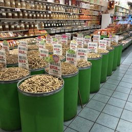rows of buckets of food in a grocery store rows of buckets of food in a grocery store