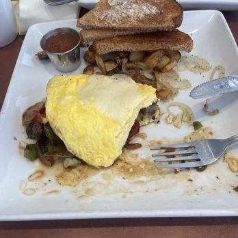 105 Cafe - Half eaten Philly Cheese Steak Omelette - American Near Me - Conroe, Texas