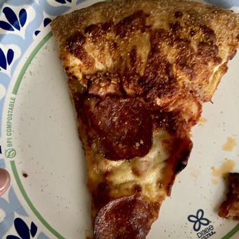Marco's Pizza - A slice of my large pepperoni pizza, half of which is just the crust - Pizza Near Me - Apopka, Florida