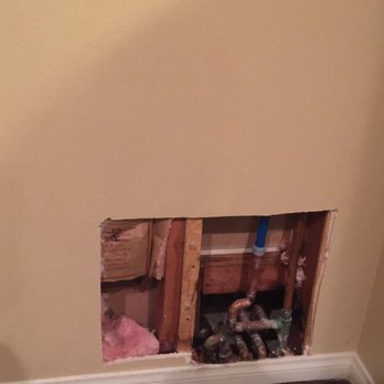 Dream Wall Design - Holes in the water heater area on both sides - Drywall Installation & Repair Near Me - Irvine, California