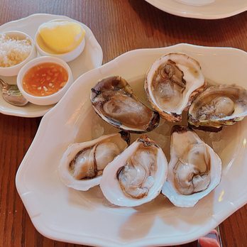 Parquet - a plate of oysters with dipping sauce - Bistros Near Me - Toronto, Ontario Parquet - a plate of oysters with dipping sauce - Bistros Near Me - Toronto, Ontario