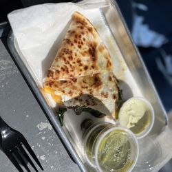 Jaco Juice & Taco Bar - Half of a shrimp quesadilla (filling includes spinach, mushrooms, and Cotija cheese)