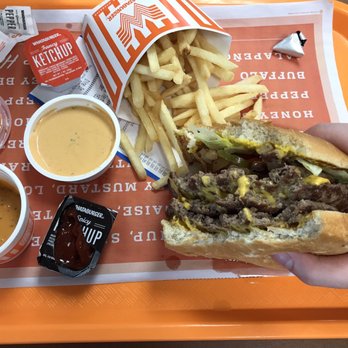 Whataburger - a person holding a hamburger and french fries - Burgers Near Me - San Antonio, Texas Whataburger - a person holding a hamburger and french fries - Burgers Near Me - San Antonio, Texas