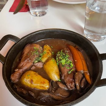 Delice & Sarrasin - Coq au Vin, Ratatouille Nicoise (behind) - French Near Me - New York, New York Delice & Sarrasin - Coq au Vin, Ratatouille Nicoise (behind) - French Near Me - New York, New York