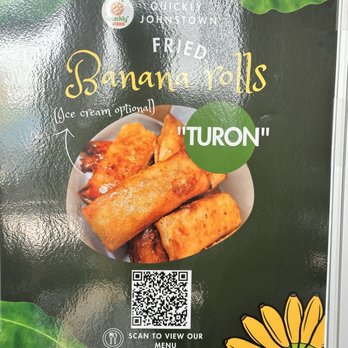 Quickly - A sign for Quickly in Johnstown, CO, promoting fried banana rolls with optional ice cream, featuring a photo of the food and a QR code. - Bubble Tea Near Me - Johnstown, Colorado