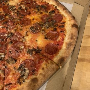 Photo of Dino's Tomato Pie - Seattle, WA, United States. pepperoni mushroom large circle pizza