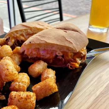 Motorworks Brewing Orlando - Pulled Pork Mac N Cheese Sandwich with tots. Forget the name but the smile on out friend's face when he bit into it said it all. - Breweries Near Me - Orlando, Florida Motorworks Brewing Orlando - Pulled Pork Mac N Cheese Sandwich with tots. Forget the name but the smile on out friend's face when he bit into it said it all. - Breweries Near Me - Orlando, Florida