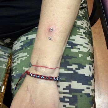 Stained In Pain Tattoos - Freshly done surface bar piercing by Richie - Tattoo Near Me - Chicago, Illinois Stained In Pain Tattoos - Freshly done surface bar piercing by Richie - Tattoo Near Me - Chicago, Illinois