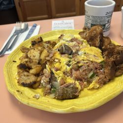 Tingley's - Meat, lovers omelette consist of diced ham, sausage, bacon, corn, beef, hash, diced onion, and green pepper and American cheese