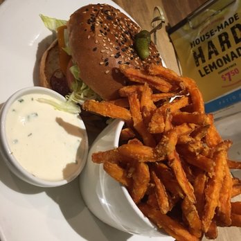 Moxies - Blackened chicken burger with sweet potato fries. - Canadian (New) Near Me - Toronto, Ontario