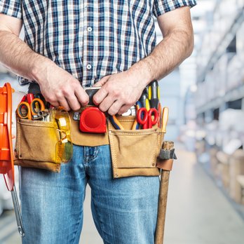 Mr Handyman - a man holding a tool belt - Handyman Near Me Mr Handyman - a man holding a tool belt - Handyman Near Me