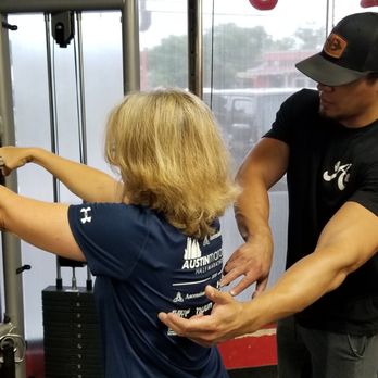 Austin Simply Fit - One of our personal trainers cueing the proper form during an exercise. - Gyms Near Me - Austin, Texas
