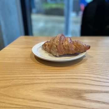Roseline Coffee - a croissant on a plate - Coffee & Tea Near Me - Portland, Oregon Roseline Coffee - a croissant on a plate - Coffee & Tea Near Me - Portland, Oregon