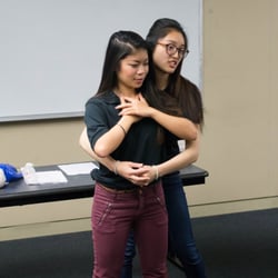UCLA AED CPR - Instructors Parra and Kristin demonstrating proper J-thrust maneuver
