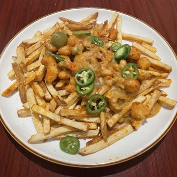 Wahoo's Seafood - Swamp fries topped with crawfish etouffe, fried cheese curds, and fresh jalapeños - Seafood Near Me - Kerrville, Texas Wahoo's Seafood - Swamp fries topped with crawfish etouffe, fried cheese curds, and fresh jalapeños - Seafood Near Me - Kerrville, Texas