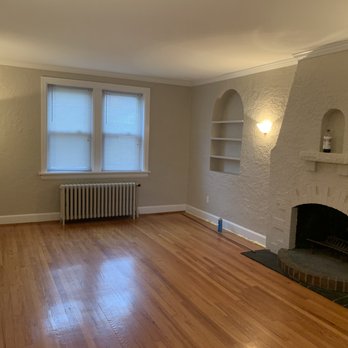 Superior Sealing And Top Coating - a living room with a fireplace - Painters Near Me - O'Fallon, Missouri Superior Sealing And Top Coating - a living room with a fireplace - Painters Near Me - O'Fallon, Missouri