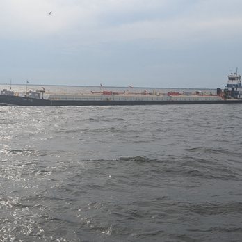 Ship Island Excursions - Passing barge - Boat Charters Near Me - Gulfport, Mississippi Ship Island Excursions - Passing barge - Boat Charters Near Me - Gulfport, Mississippi