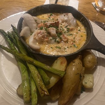 Lakehouse Grille - Haddock in a lobster sauce with fingerlings and asparagus - American Near Me - Meredith, New Hampshire