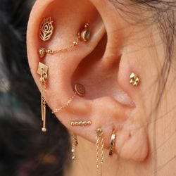 Deep Roots Tattoo & Body Piercing - Ear curation and styling by John.
Jewelry from Pupil Hall, Buddha Jewelry, BVLA, and Regalia.