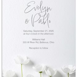 White flowers on white bridal shower or wedding invitation