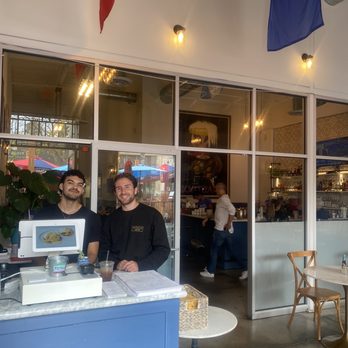 Immigrant Son Caffe - View of inside entrance  & the great staff (I think the owner is the one in white inside the door) - New American Near Me - Ventura, California