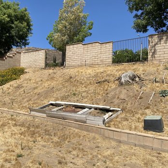 Ready For You Landscaping services - Before photograph of the terrible landslide of dirt from gophers, ground squirrels, rain, erosion, wind, etc. - Landscaping Near Me - Banning, California