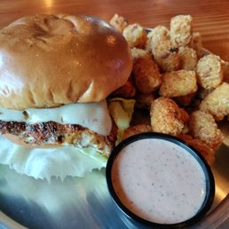 Chicken sandwich Cajun tots on the side and comes with a special house sauce. Yum Chicken sandwich Cajun tots on the side and comes with a special house sauce. Yum
