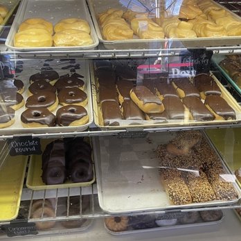 Nord's Bakery - Left to right, top to bottom Glazed, French fry Choc iced, choc iced long Johns, maple and bacon - Bakeries Near Me - Louisville, Kentucky
