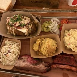 Brisket, pork ribs, poppyseed Cole slaw, corn casserole, potato salad and a baked potato with jalapeno sausage.