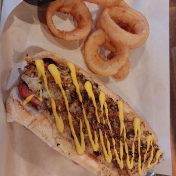 28 Songs Brewhouse + Kitchen - Kraut Dog with Onion Rings - Brewpubs Near Me - Boerne, Texas 28 Songs Brewhouse + Kitchen - Kraut Dog with Onion Rings - Brewpubs Near Me - Boerne, Texas