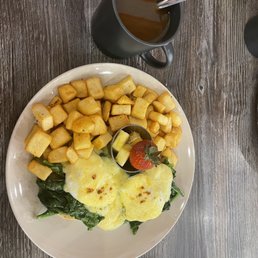 Egg Florentine with home fries and a coffee