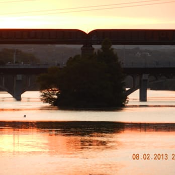 Lone Star Riverboat - View of bridge on Lake Lady Bird during the Bat Tour - Boat Charters Near Me - Austin, Texas