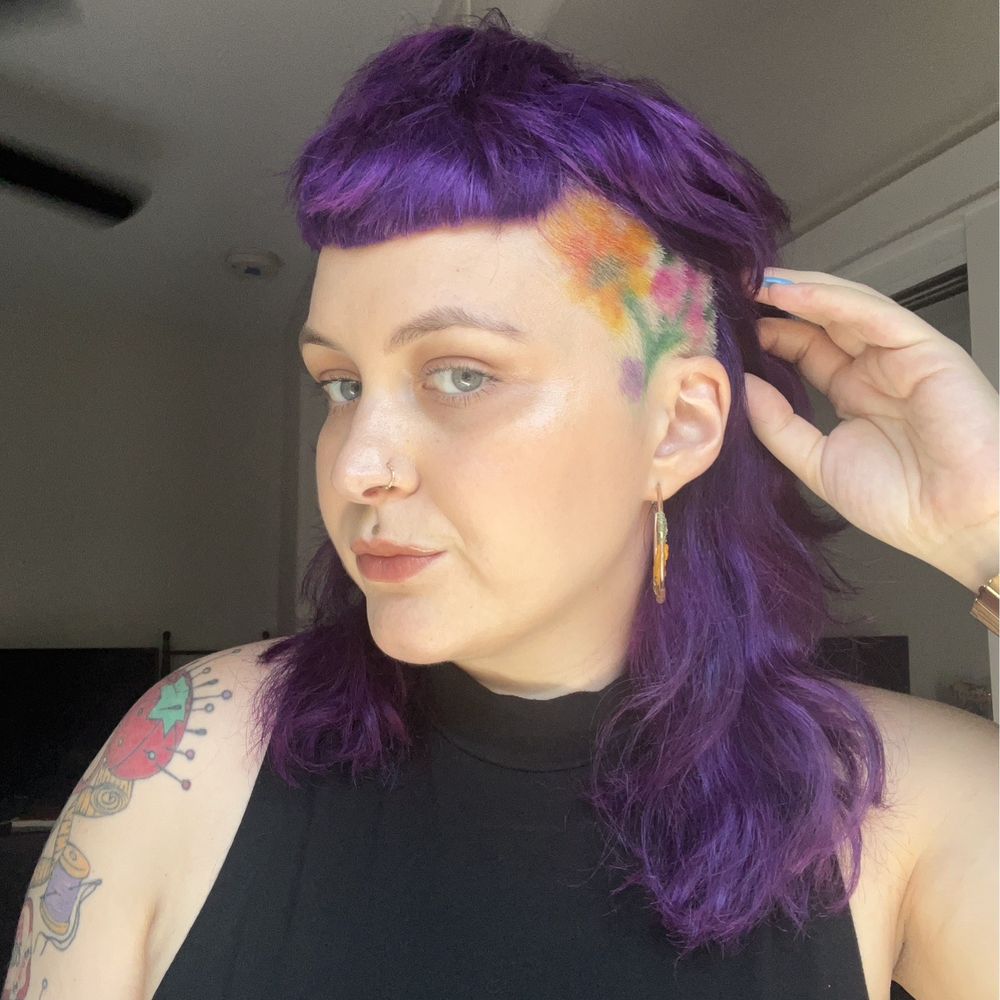Freebirds Salon - shaggy cut, purple hair, and hand-painted floral design on shaved sides by Stasi - Hair Salons Near Me - Long Beach, California Freebirds Salon - shaggy cut, purple hair, and hand-painted floral design on shaved sides by Stasi - Hair Salons Near Me - Long Beach, California