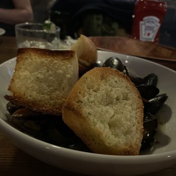 Proving Ground Waterfront Dining - Mussels in garlic and White wine broth toasty garlic bread - Tiki Bars Near Me - Highlands, New Jersey Proving Ground Waterfront Dining - Mussels in garlic and White wine broth toasty garlic bread - Tiki Bars Near Me - Highlands, New Jersey