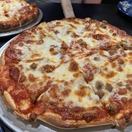 Medium pepperoni and ground beef pizza