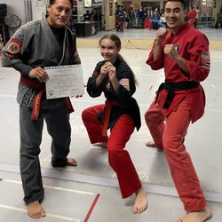 Dragons Den MMA - My daughter Earned her Orange Belt!