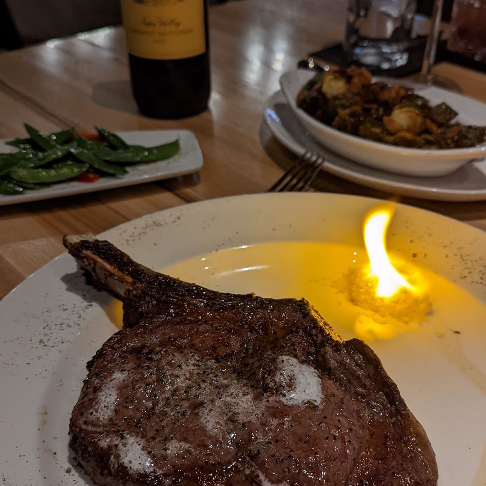 Silver Fox Steakhouse - Bone in Ribeye Flaming salt, which goes out and really good with the steak - Steakhouses Near Me - Fort Worth, Texas Silver Fox Steakhouse - Bone in Ribeye Flaming salt, which goes out and really good with the steak - Steakhouses Near Me - Fort Worth, Texas