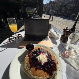 Wild Bueberry Pancakes and mimosa Wild Bueberry Pancakes and mimosa