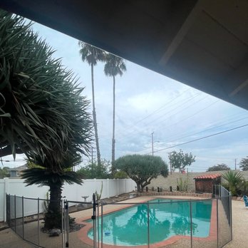Lakeview Pool Fencing - Backyard with Paul and fence before remodel - Fences & Gates Near Me