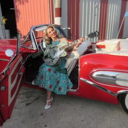 Matt's Auto Body Shop - 50's girl poses with the Buick at Jalopy Fest.