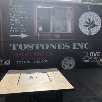 Tostones - Our door fire pit and tables to enjoy your meal - Food Trucks Near Me - Tampa, Florida Tostones - Our door fire pit and tables to enjoy your meal - Food Trucks Near Me - Tampa, Florida