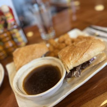 The District Kitchen And Saloon - Roast beef dip with tater tots - Bars Near Me - Cripple Creek, Colorado The District Kitchen And Saloon - Roast beef dip with tater tots - Bars Near Me - Cripple Creek, Colorado