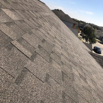 Relief Roofing and Restoration - Roof installation, shingle close-up. - Roofing Near Me Relief Roofing and Restoration - Roof installation, shingle close-up. - Roofing Near Me