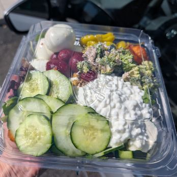 Jason's Deli - Big salad - A large salad in a clear plastic container includes sliced cucumbers, cherry tomatoes, broccoli, shredded chicken, and cottage cheese, with a side of boiled egg. - Delis Near Me - Albuquerque, New Mexico