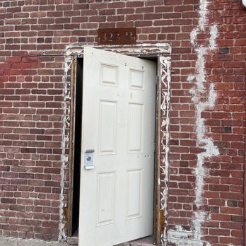 House Divided - Door in the alley to the left of four score coffee - Cocktail Bars Near Me - Roseville, California