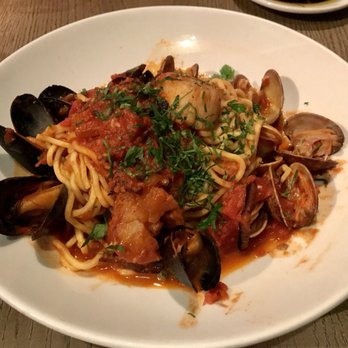 Pasta Moon - Spaghetti Puttanesca(scallops, calamari, clams, mussels, shrimp, in a spicy tomato sauce) - Italian Near Me - Half Moon Bay, California Pasta Moon - Spaghetti Puttanesca(scallops, calamari, clams, mussels, shrimp, in a spicy tomato sauce) - Italian Near Me - Half Moon Bay, California